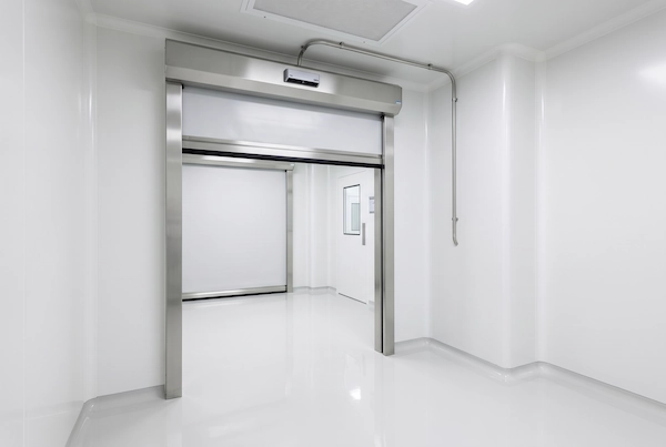 Non-invasive overhead radar installation on a cleanroom rapid roll-up door preserving epoxy flooring integrity